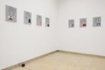 Exhibition view Kunstpavillon with seven painted pictures and a small cooking pot sculpture on the floor
