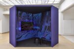 Photo of the exhibition at Kunstpavillon with a video installation in a blue box