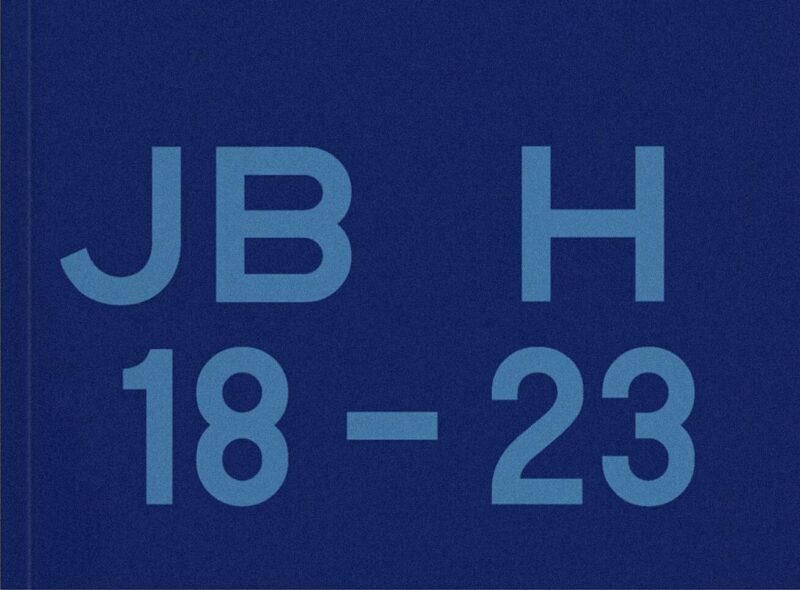A dark blue area with the letters “JB” separated by an “H” and the numbers 18–23 in light blue